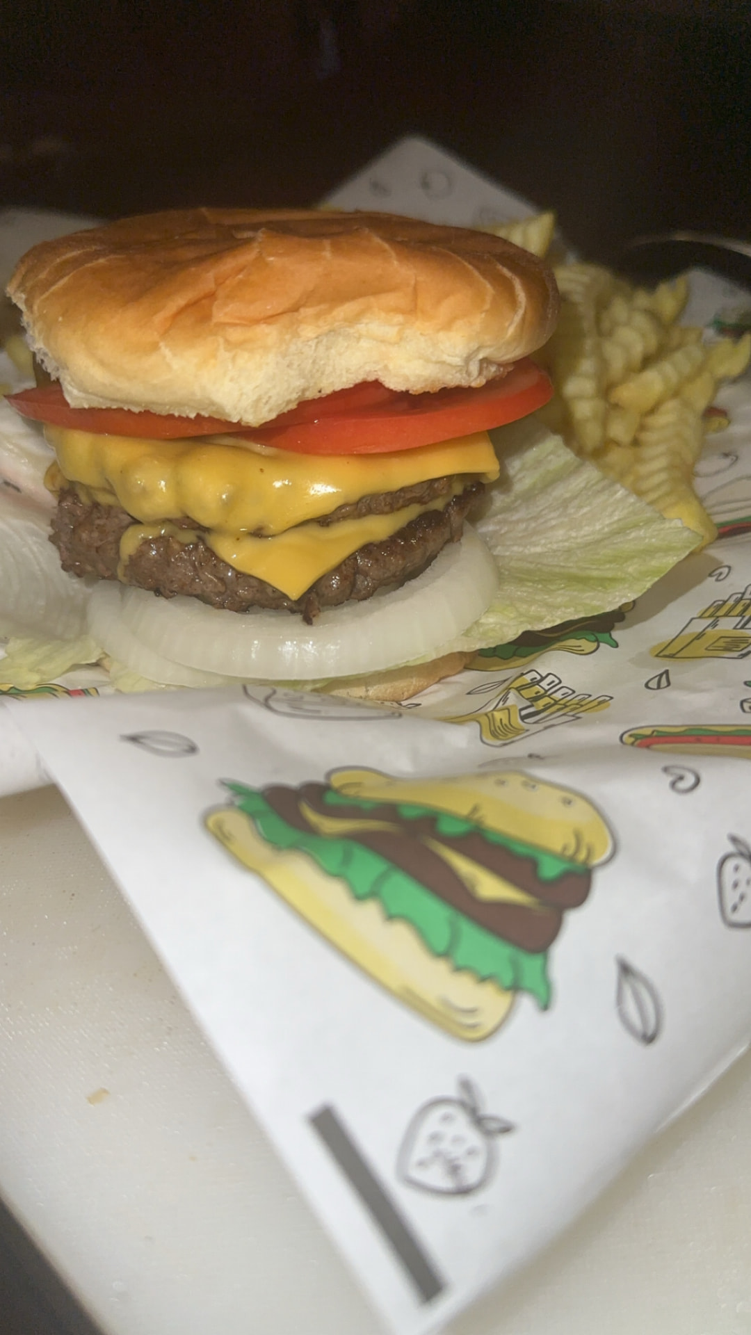 Double cheeseburger with crinkle fries at Nans Olde Town Grill